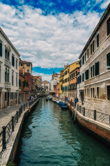 Fototapeta na wymiar Small canal with boats in Venice, Italy