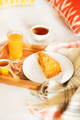 Cozy breakfast in bed with tea
