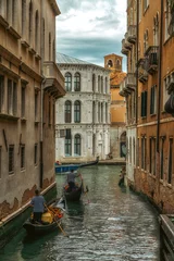 Poster Traditional Venice gondola on famous canal. Beautiful Venice view. © atosan