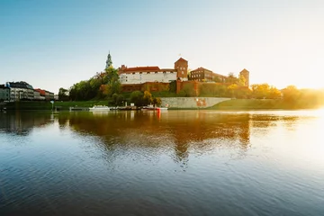 Fotobehang Wawel castle famous landmark in Krakow Poland. Landscape on coast river Wis © alexanderuhrin
