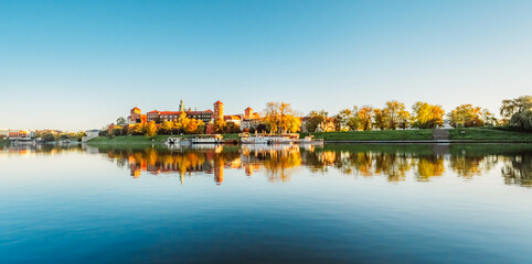 Wawel castle famous landmark in Krakow Poland. Landscape on coast river Wis - obrazy, fototapety, plakaty