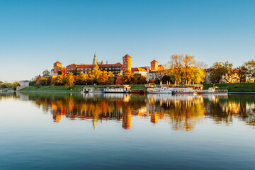 Wawel castle famous landmark in Krakow Poland. Landscape on coast river Wis - obrazy, fototapety, plakaty