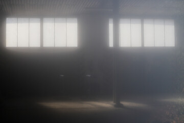 Sunrays in a retro foggy garage. Old lobby background
