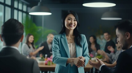 Millennial boss team leader introducing New asian woman employee to colleagues in creative office workplace Welcoming hired newcomer member to team first work day get clapping hands