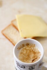 cup of coffee with milk, spontaneous, real, homemade breakfast concept