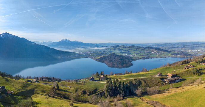 Aerial view of the Lake of Zug in central Switzerland with the famous Alpen peaks Rigi and Pilatus at the background