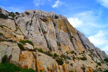 Fototapeta premium landscape in the mountains, wall of rocks and Moorish Cave near Bolonia, Cueva del Moro, Andalusia, Spain