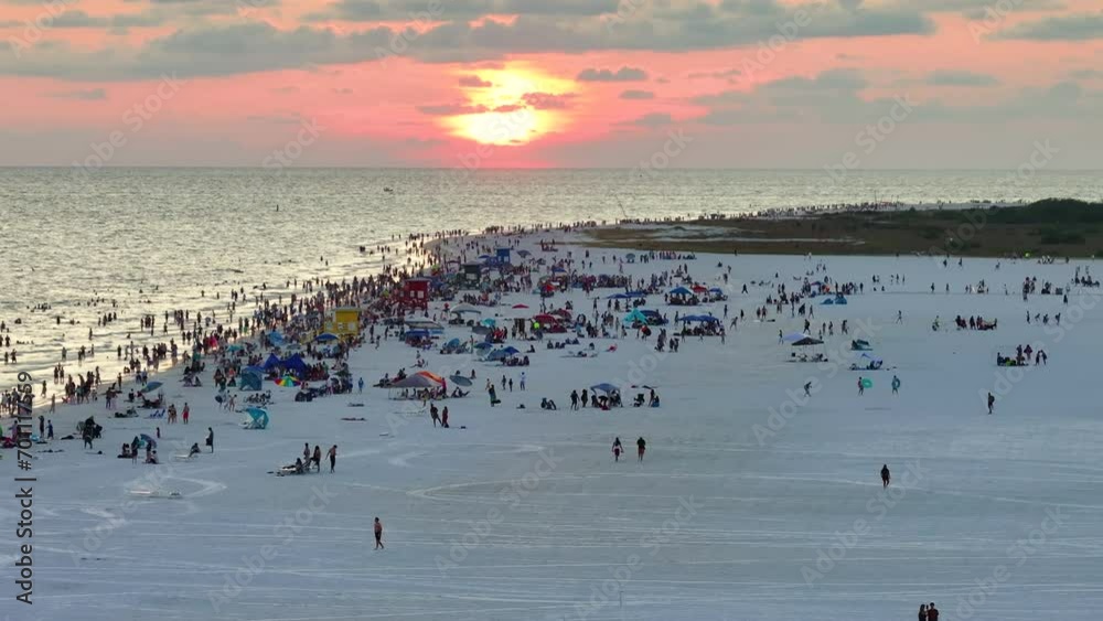 Wall mural Aerial view of Siesta Key beach in Sarasota, USA. Many people enjoying vacation time swimming in gulf water and relaxing on warm Florida sun at sunset