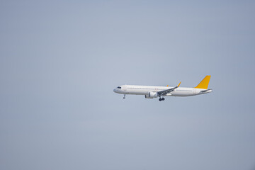 Fototapeta na wymiar A cargo plane ascending with the landing gear deployed
