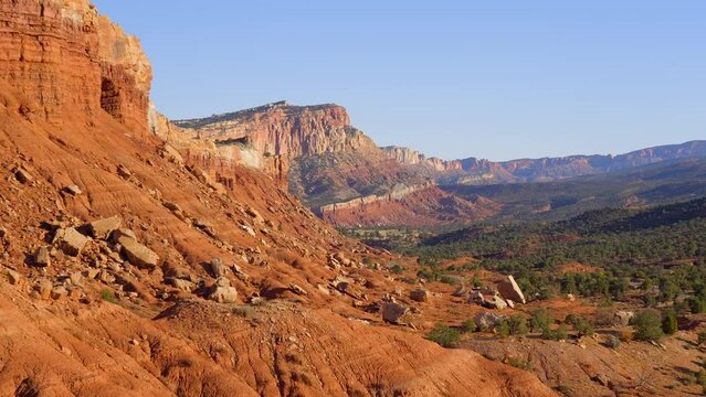 Establishing shot of mountains with red rocks in Fruita Scenic Road, Capital Reef National Park, Utah, North America. Day time. ProRes 422 HQ.