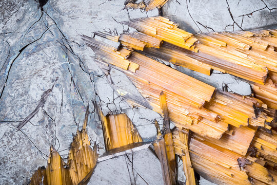 hematite with gold rutile macro photography detail texture background. close-up raw rough unpolished semi-precious gemstone
