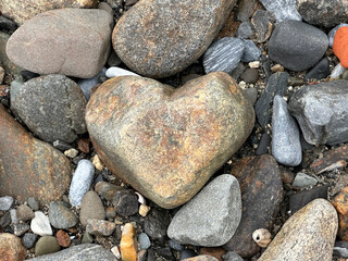 Heart-shaped stone on the beach