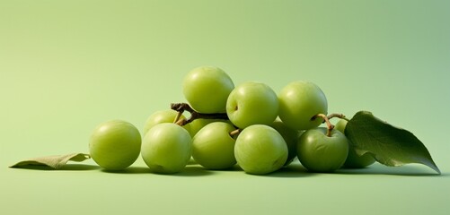 A bunch of greengages, side view, realistic with Agfa Vista 400 film effect, on a light green...
