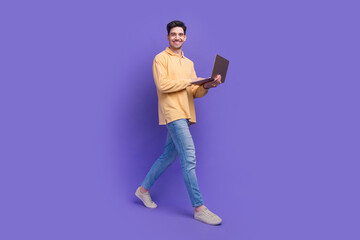 Full size photo of attractive man instagram twitter facebook telegram dressed stylish yellow clothes isolated on purple color background