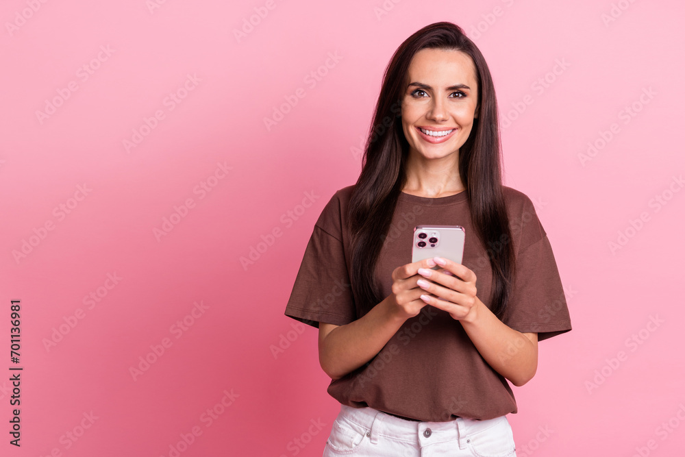 Sticker Portrait of young blogging optimistic cheerful businesswoman surfing internet browsing instagram reels isolated on pink color background