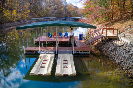 Boat dock on a secluded lake cove with fishing and swimming piers, with beautiful fall colors on beautiful Tims Ford Lake in Winchester Tennessee