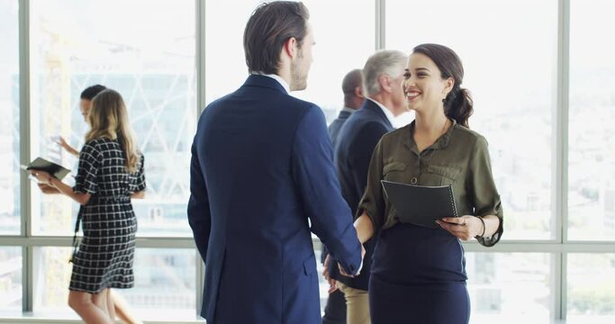 Business people, shaking hands and job interview, Human Resources meeting or career introduction in lobby. Happy woman or clients handshake with documents, resume and talking of recruitment or hiring