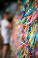 Remembrance ribbons tied to the iron railing of the Senhor do Bonfim church in the city of Salvador, Bahia.