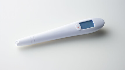 Electronic thermometer with a digital display on a white backdrop, an indispensable tool for health diagnostics. The device is commonly used in home and clinical settings.
