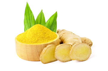 Ground ginger in a wooden bowl and fresh ginger on the side with green leaves. isolated on white background.