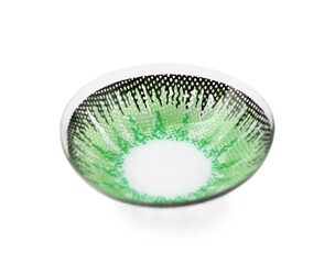 One green contact lens isolated on white