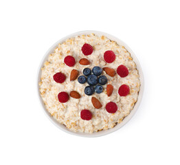 Tasty boiled oatmeal with berries and almonds in bowl isolated on white, top view