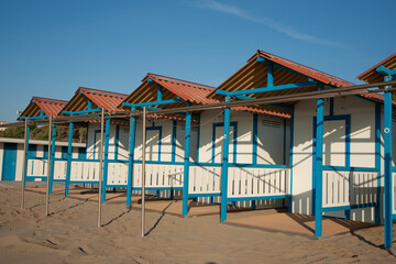 Row of changing sheds in beach on Lido