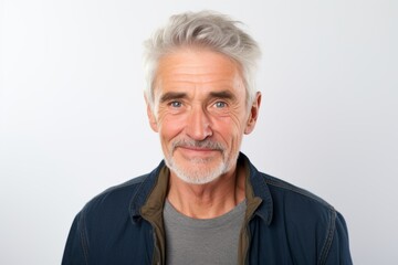 Portrait of a senior man with grey hair on a white background