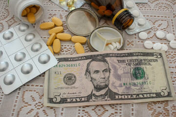 dollars and pills on the table