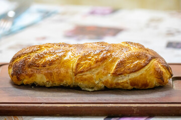Traditional and Perfect homemade juicy Beef Wellington, tenderloin dish on rustic wooden table. Christmas food