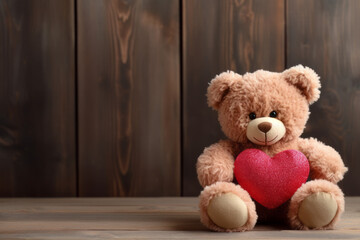 Teddy bear holding a plush heart, Valentine's Day gift isolated in front of a wooden plank wall