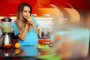 Pregnant Woman Who Feels Nauseated and Eats a Lemon. Mother to be having morning sickness trying natural remedy
