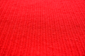texture of red wool knitted yarn, woolen fabric background