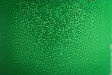 water drop on green beverage cans background, texture of cold aluminium package - obrazy, fototapety, plakaty