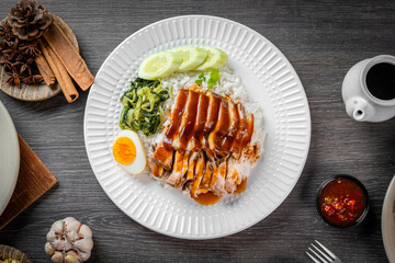 Braised pork leg with boiled eggs and rice on a plate
