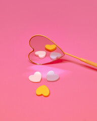 Heart Shaped Mirror Reflecting Valentine's Day Heart Shapes on a Pink Background