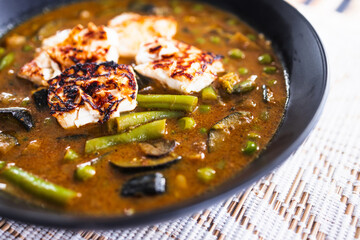 plant-based vegetable green curry with fried silken tofu