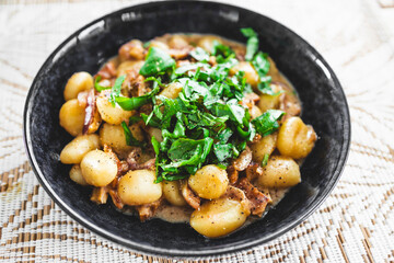 plant-based gnocchi with mock meat chicken and fresh herbs