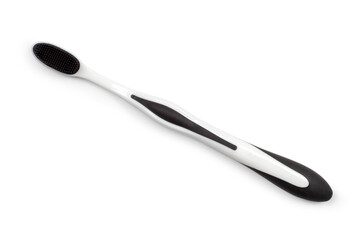 A modern toothbrush made of white plastic. Toothbrush on white background.