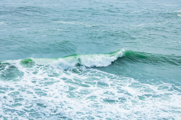 Wave splashing close-up. Crystal clear sea water, in the ocean in San Francisco Bay, blue water, pastel colors.