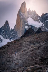 Cercles muraux Cerro Torre Men trekking to the top of mountain with Mt.Cerro torre as background and beautiful sunset (Patagonia, El chalten, Argentina)