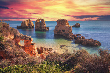 Coastal rocky seascape, view of Praia da Marinha beach in Algarve region in Atlantic ocean, Portugal, Europe