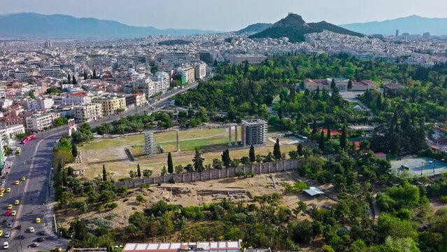 Aerial view of the Temple of Olympian Zeus, Athens National Garden and Zappeion Hall. View from above of a big historic park with exotic plants and archaeological remains, site of an ancient sanctuary