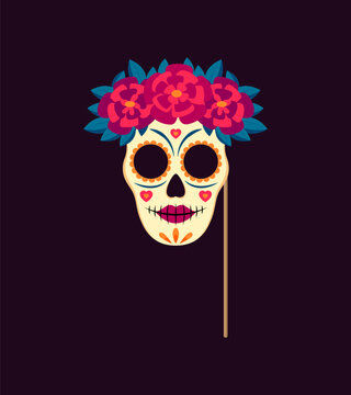 Dead day photo booth mask with props. Mexican dia de los muertos holiday Katrina sugar skull with patterns, vibrant colors, and flower wreath. Delicate balance of beauty and spookiness for celebration