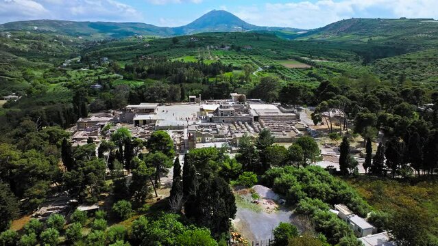 View from above Knossos Palace complex, the largest Bronze Age archaeological site in Crete, Greece. Aerial view of a Romanized royal Knossos, modern port city on the north-central coast of Crete.