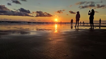 The beautiful and pretty sunset view on Nusa Penida Island with a beautiful orange sky