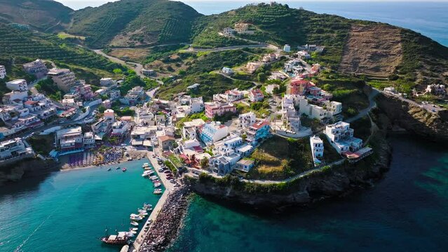 Aerial view of tourist resort hotels and Livadi Beach in Crete, Greece. Luxury villas by Bali Seaside Village with turquoise crystal clear water on Greek Island.