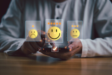 Customer service and Satisfaction concept, Businessman choosing on the happy Smile face icon,...