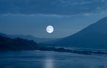 Naklejka na ściany i meble Super white moon over blue mountains and river