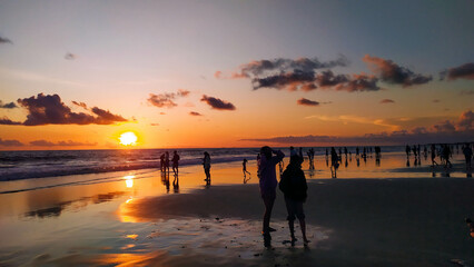 A modern outdoor living space featuring a dining area and lounge seating.